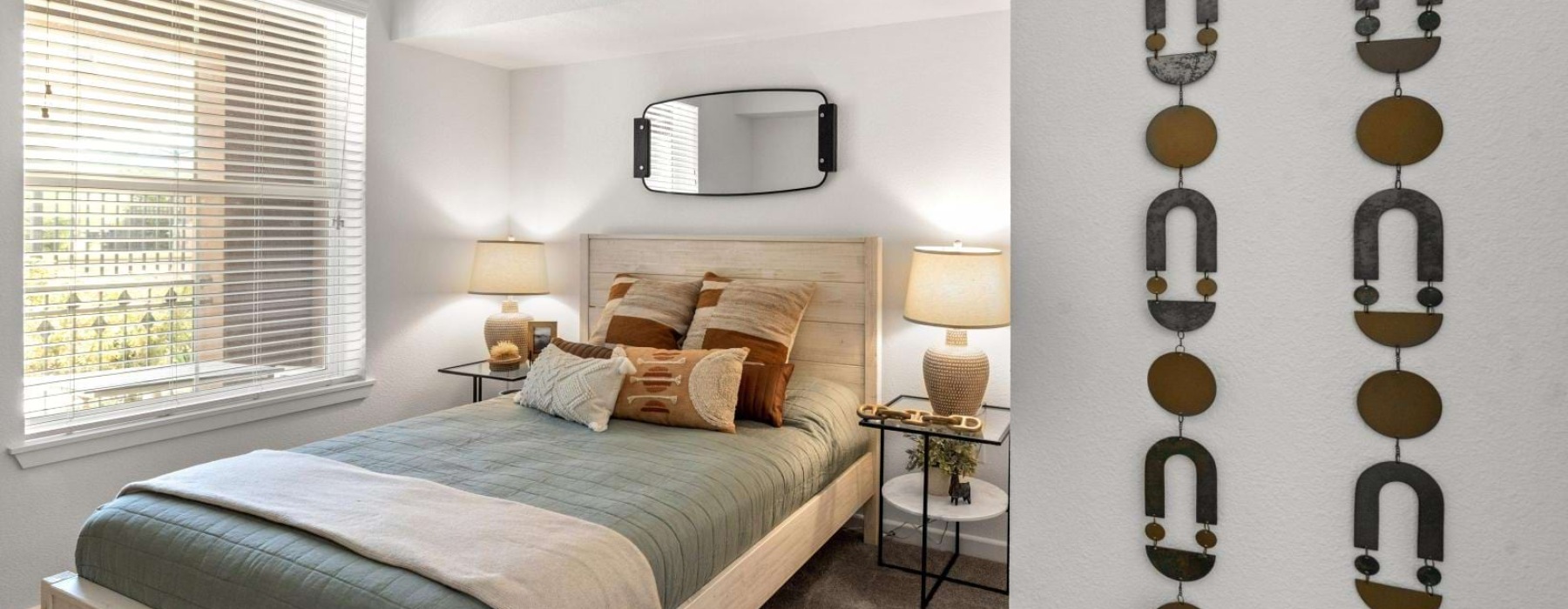 a bedroom with a bed and lamps