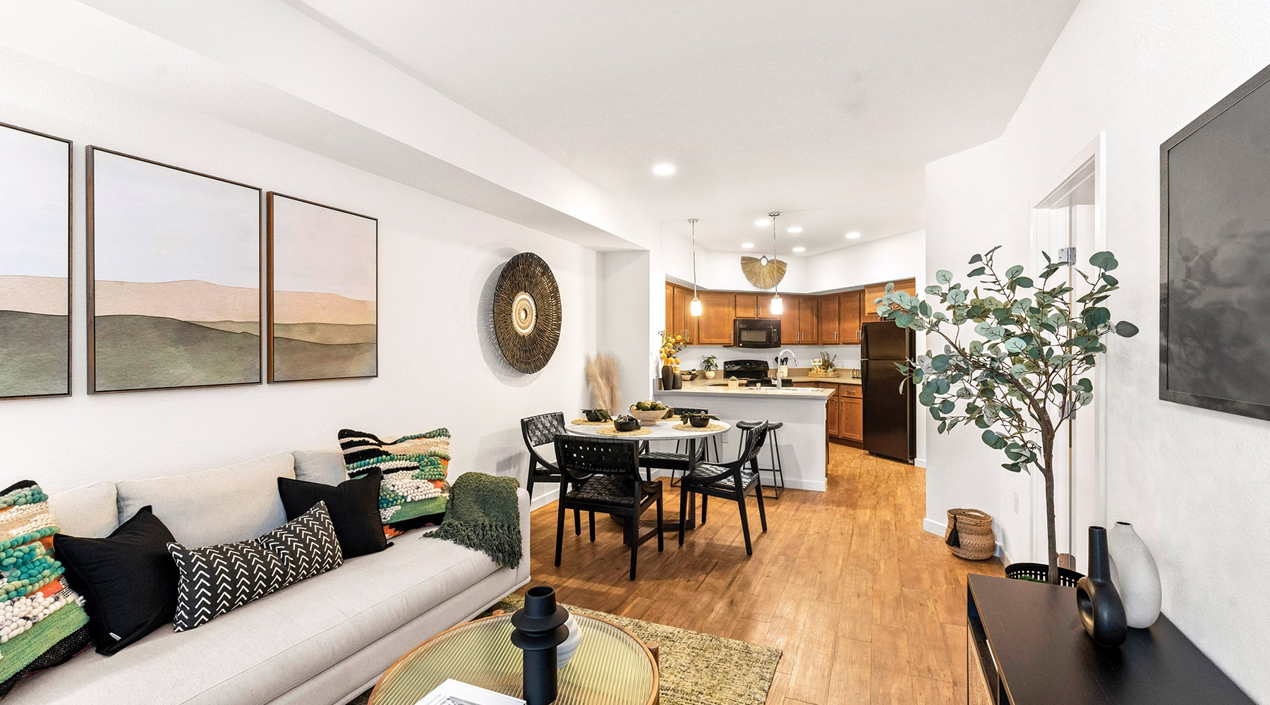 Settle into comfort at Amalfi a living room with a couch and a table